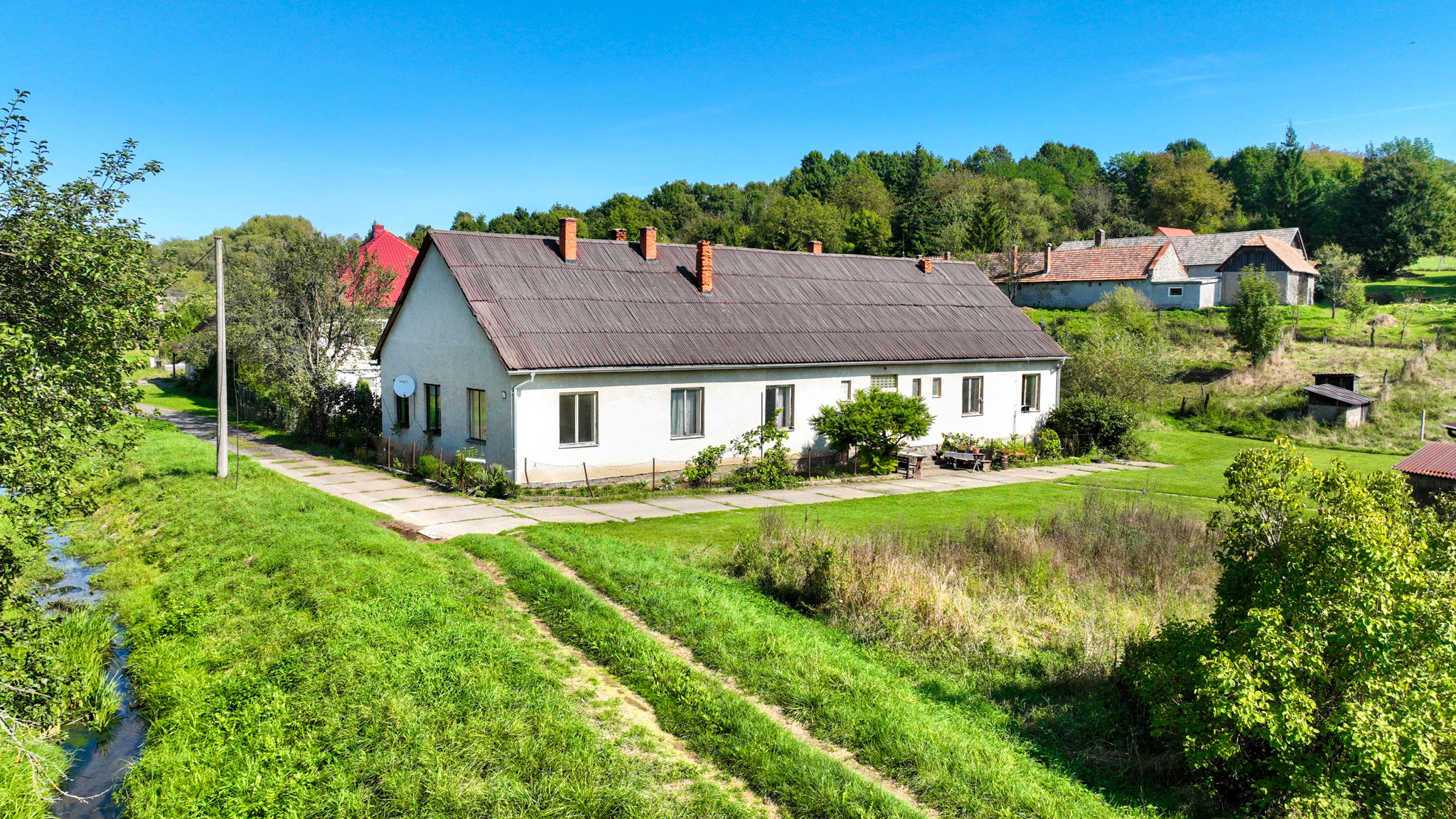 Rodinný dom so štyrmi bytovými jednotkami v obci Beluj